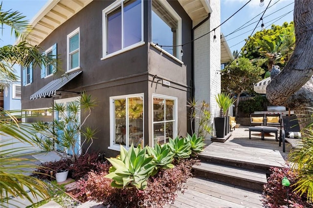 31907 9th Ave, Laguna Beach, CA 92651 - view of side of home with stucco siding and a wooden deck