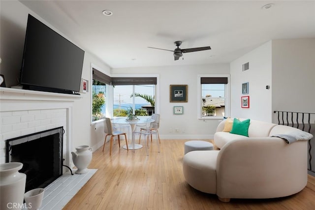31907 9th Ave, Laguna Beach, CA 92651 - living room with ceiling fan, healthy amount of natural light, wood finished floors, a brick fireplace, and recessed lighting
