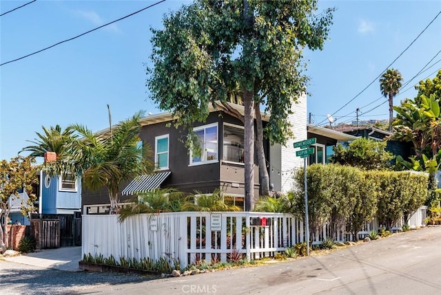 31907 9th Ave, Laguna Beach, CA 92651 - obstructed view of property featuring a fenced front yard and stucco siding