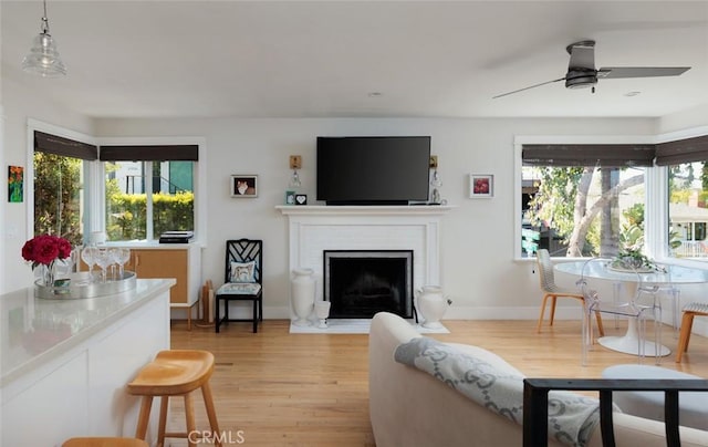 31907 9th Ave, Laguna Beach, CA 92651 - living room featuring light wood finished floors, ceiling fan, and a fireplace with flush hearth