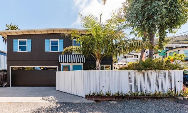 31907 9th Ave, Laguna Beach, CA 92651 - view of front of home with concrete driveway and a garage