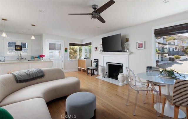 31907 9th Ave, Laguna Beach, CA 92651 - living area featuring a ceiling fan, a fireplace with flush hearth, and wood finished floors