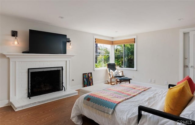 31907 9th Ave, Laguna Beach, CA 92651 - bedroom with a fireplace and wood finished floors