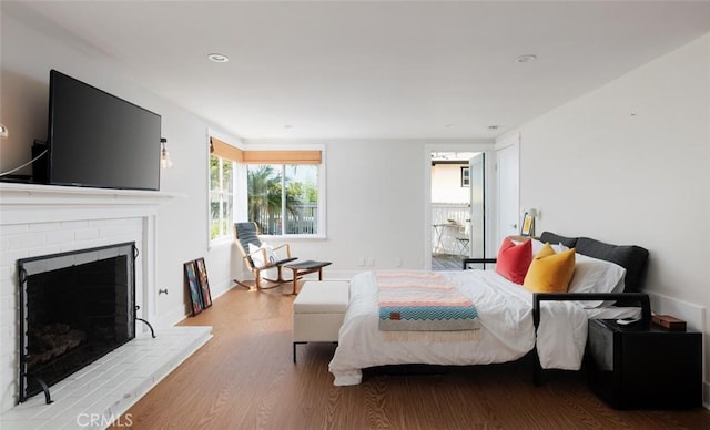 31907 9th Ave, Laguna Beach, CA 92651 - bedroom featuring wood finished floors and a brick fireplace