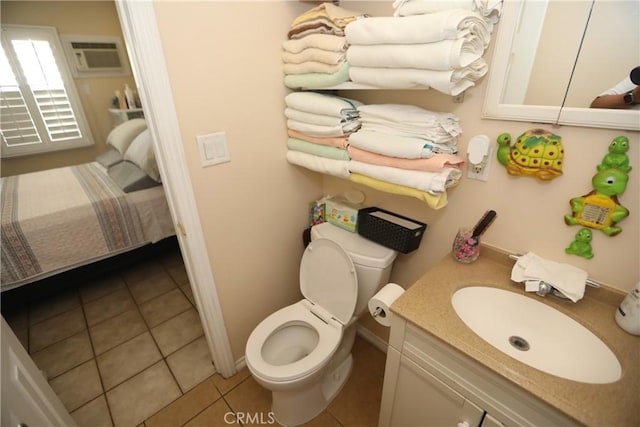 2432 N Eastern Ave, Los Angeles, CA 90032 - bathroom with a wall mounted air conditioner, tile patterned floors, vanity, and connected bathroom