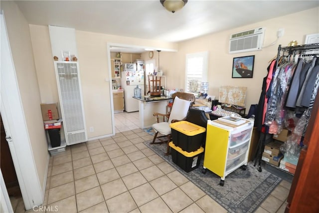 2432 N Eastern Ave, Los Angeles, CA 90032 - home office featuring a heating unit, a wall unit AC, and light tile patterned floors