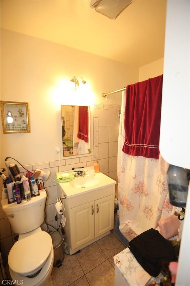 2432 N Eastern Ave, Los Angeles, CA 90032 - bathroom featuring tile patterned floors, vanity, curtained shower, and tile walls
