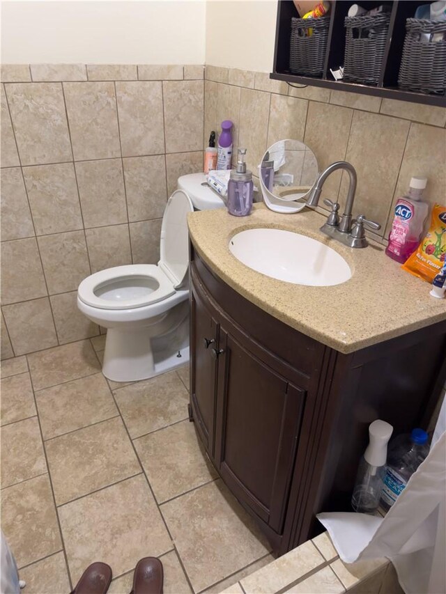 2432 N Eastern Ave, Los Angeles, CA 90032 - bathroom with vanity, tile patterned flooring, tile walls, and backsplash