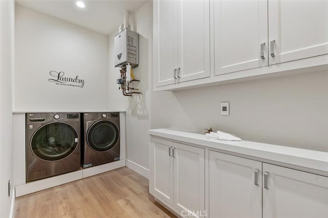 109 Buckskin Rd, Bell Canyon, CA 91307 - laundry area with independent washer and dryer, cabinet space, water heater, light wood finished floors, and recessed lighting