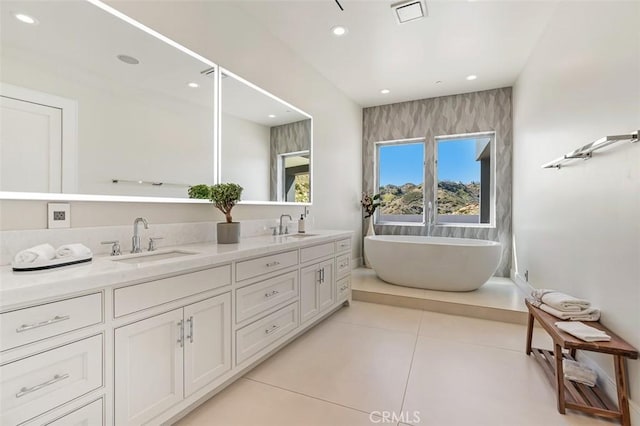 109 Buckskin Rd, Bell Canyon, CA 91307 - full bathroom with double vanity, a freestanding bath, tile patterned flooring, and recessed lighting