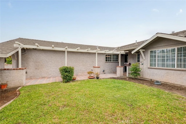7751 La Mesa Way, Buena Park, CA 90620 - back of house featuring stucco siding, a yard, and a shingled roof