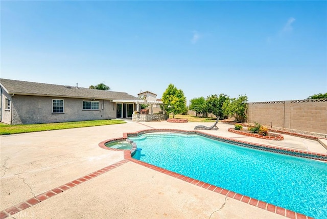 7751 La Mesa Way, Buena Park, CA 90620 - view of swimming pool with a patio area, a fenced backyard, and a pool with connected hot tub
