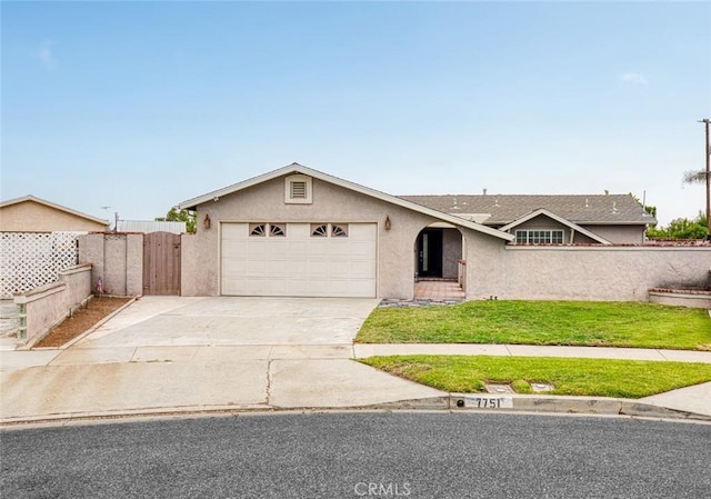 7751 La Mesa Way, Buena Park, CA 90620 - ranch-style home with stucco siding, driveway, a garage, and a gate