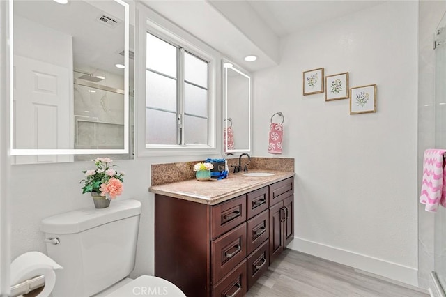 7751 La Mesa Way, Buena Park, CA 90620 - bathroom with wood finished floors, vanity, a shower, and recessed lighting