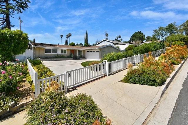 20516 Aetna St, Woodland Hills, CA 91367 - ranch-style house featuring driveway, a garage, and a fenced front yard