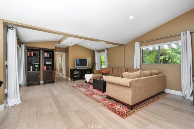 20516 Aetna St, Woodland Hills, CA 91367 - living area featuring lofted ceiling, light wood finished floors, and recessed lighting