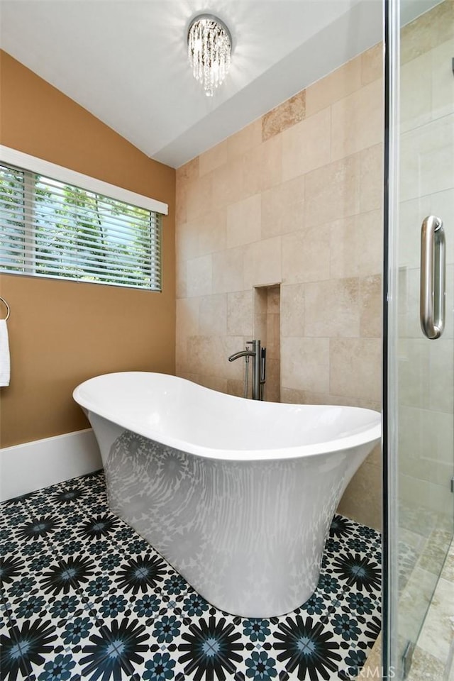 20516 Aetna St, Woodland Hills, CA 91367 - bathroom featuring tile walls, a shower stall, a soaking tub, and tile patterned floors