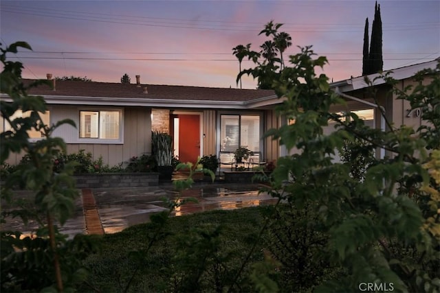 20516 Aetna St, Woodland Hills, CA 91367 - view of front of property featuring board and batten siding and a patio area