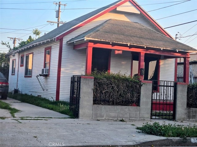 3120 W 63rd St, Los Angeles, CA 90043 - bungalow with covered porch, a fenced front yard, and cooling unit