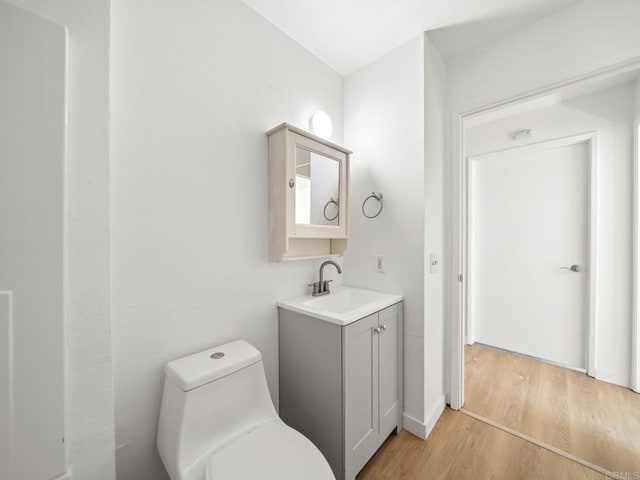 6390 Rancho Mission Rd Unit 202, San Diego, CA 92108 - half bathroom with vanity and wood finished floors