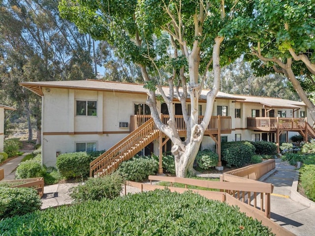 6390 Rancho Mission Rd Unit 202, San Diego, CA 92108 - view of front of property featuring stairway and stucco siding