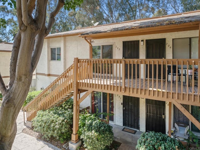 6390 Rancho Mission Rd Unit 202, San Diego, CA 92108 - view of front of house featuring stucco siding and stairway