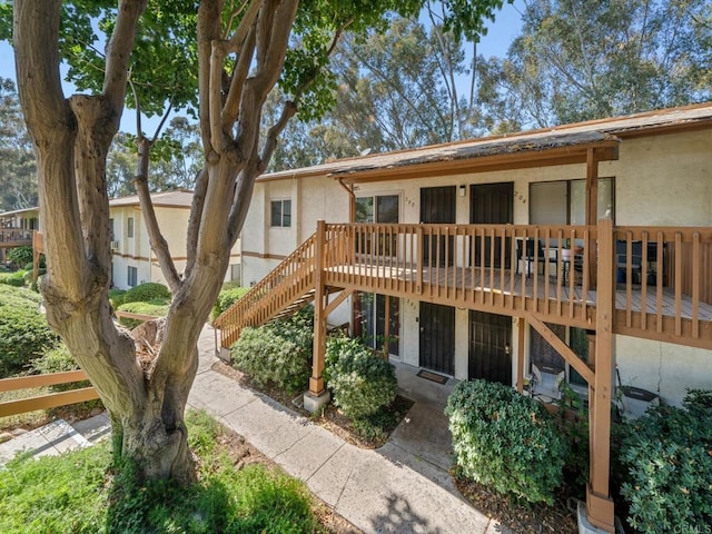 6390 Rancho Mission Rd Unit 202, San Diego, CA 92108 - view of front of house with stucco siding, stairs, and a deck
