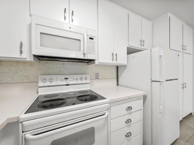 6390 Rancho Mission Rd Unit 202, San Diego, CA 92108 - kitchen featuring white appliances, light countertops, white cabinets, and decorative backsplash