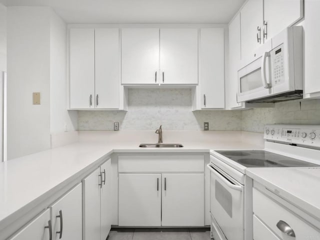 6390 Rancho Mission Rd Unit 202, San Diego, CA 92108 - kitchen featuring white appliances, white cabinetry, decorative backsplash, and light countertops