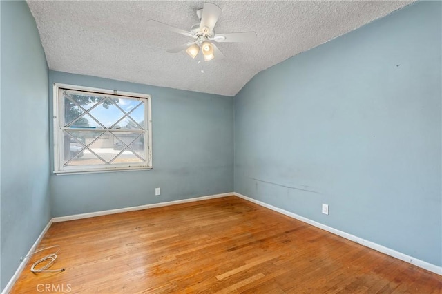 502 Tasman Ave, Pomona, CA 91767 - empty room with a textured ceiling, ceiling fan, wood finished floors, and lofted ceiling