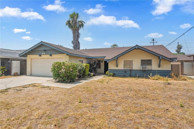 502 Tasman Ave, Pomona, CA 91767 - ranch-style home featuring a garage, driveway, cooling unit, and stucco siding