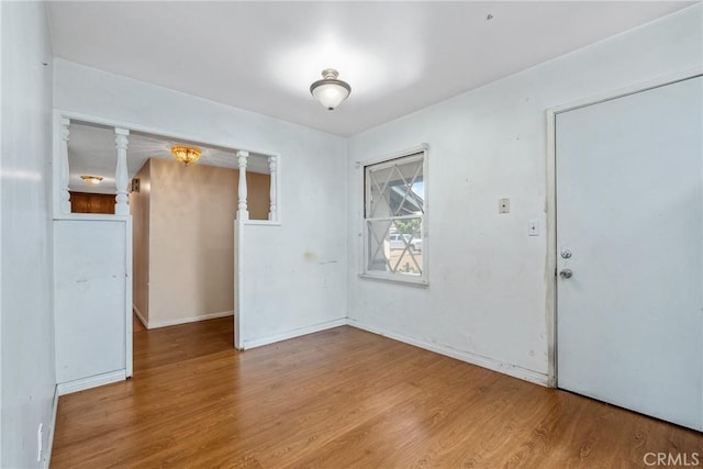 502 Tasman Ave, Pomona, CA 91767 - unfurnished room with wood finished floors and baseboards