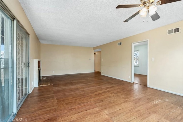 502 Tasman Ave, Pomona, CA 91767 - unfurnished room with a textured ceiling, wood finished floors, and a ceiling fan