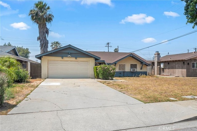 502 Tasman Ave, Pomona, CA 91767 - view of front facade featuring a garage, driveway, stucco siding, cooling unit, and a front lawn