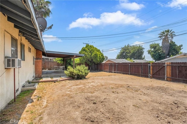 502 Tasman Ave, Pomona, CA 91767 - fenced backyard featuring cooling unit and a patio