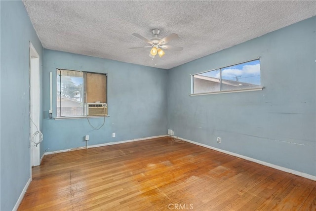 502 Tasman Ave, Pomona, CA 91767 - unfurnished room featuring wood finished floors, a ceiling fan, a textured ceiling, and cooling unit
