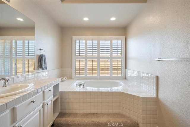 81 Via Larga Vis, Bonsall, CA 92003 - bathroom featuring healthy amount of natural light, vanity, a bath, recessed lighting, and a textured wall