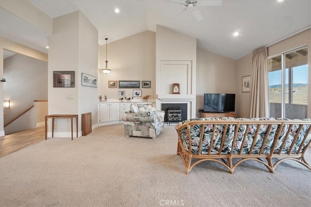 81 Via Larga Vis, Bonsall, CA 92003 - living area with light carpet, ceiling fan, vaulted ceiling, recessed lighting, and a fireplace