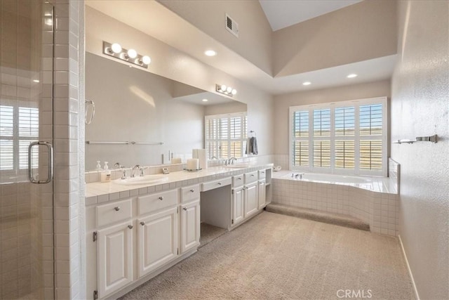 81 Via Larga Vis, Bonsall, CA 92003 - bathroom with double vanity, a shower stall, recessed lighting, a relaxing tiled tub, and a textured wall