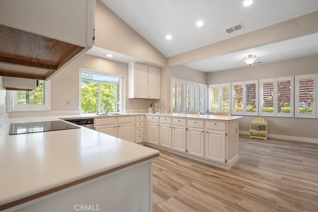 81 Via Larga Vis, Bonsall, CA 92003 - kitchen featuring a peninsula, light countertops, white cabinets, recessed lighting, and light wood-style floors