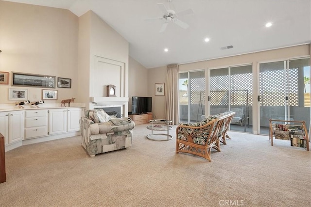 81 Via Larga Vis, Bonsall, CA 92003 - living room featuring light colored carpet, a ceiling fan, high vaulted ceiling, a fireplace, and recessed lighting