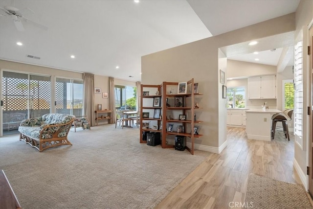 81 Via Larga Vis, Bonsall, CA 92003 - living room with light wood-style floors, vaulted ceiling, healthy amount of natural light, recessed lighting, and a ceiling fan