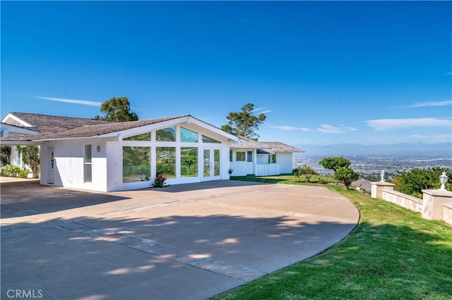 13 Buggy Whip Dr, Rolling Hills, CA 90274 - view of front of house with concrete driveway and a front lawn