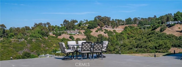 13 Buggy Whip Dr, Rolling Hills, CA 90274 - view of patio with outdoor dining space and a forest view