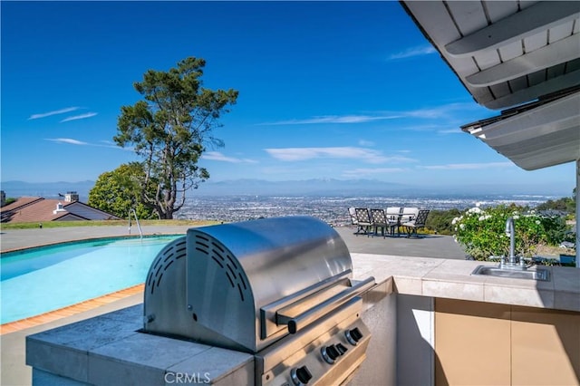 13 Buggy Whip Dr, Rolling Hills, CA 90274 - view of patio with exterior kitchen, an outdoor pool, and outdoor dining area