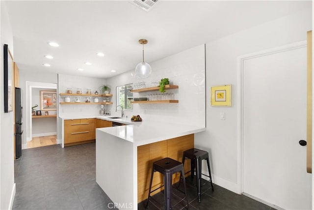2008 N Capella Ct, Costa Mesa, CA 92626 - kitchen with open shelves, freestanding refrigerator, a peninsula, modern cabinets, and light countertops