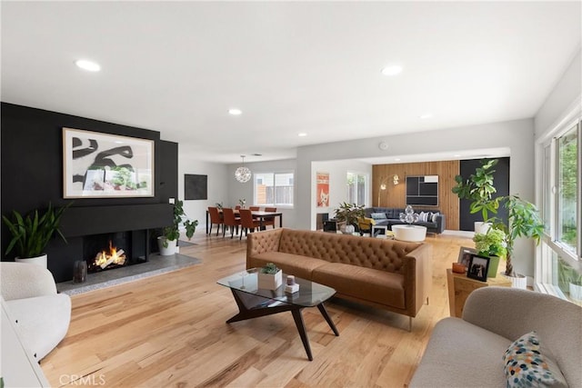 2008 N Capella Ct, Costa Mesa, CA 92626 - living room featuring plenty of natural light, recessed lighting, light wood-style floors, and a warm lit fireplace