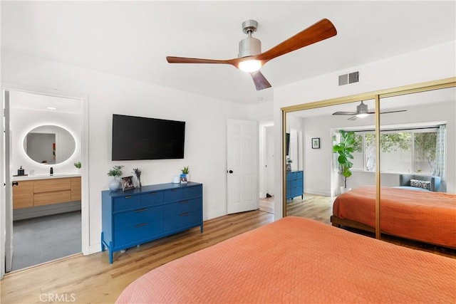 2008 N Capella Ct, Costa Mesa, CA 92626 - bedroom featuring light wood-type flooring, connected bathroom, ceiling fan, and a closet