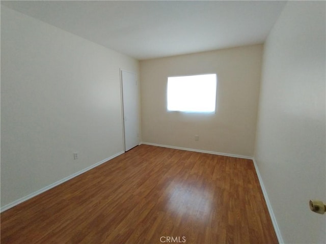 13410 Berg St, Sylmar, CA 91342 - unfurnished room with wood finished floors and baseboards