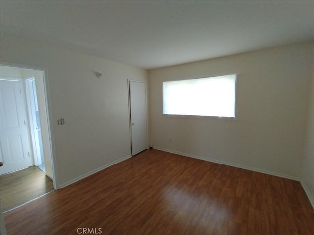 13410 Berg St, Sylmar, CA 91342 - empty room featuring wood finished floors and baseboards